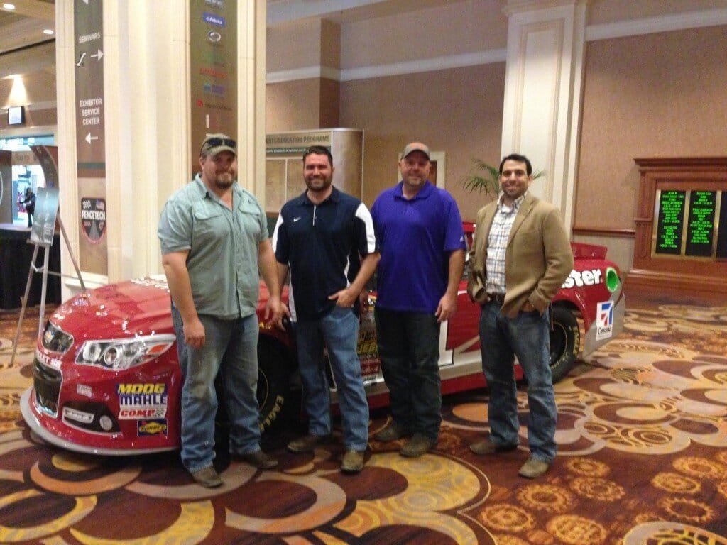 fencemaster salesmen at fencetech show taking a picture